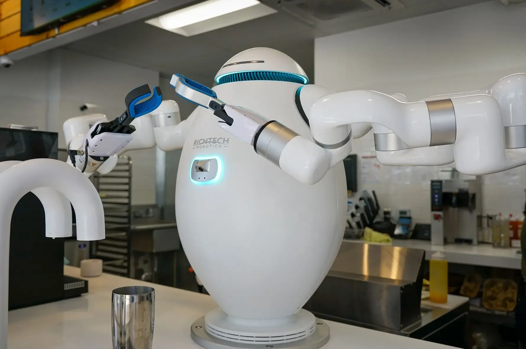 Richtech ADAM robot preparing drinks behind a counter