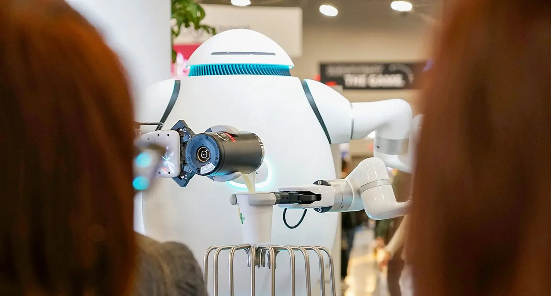 Richtech ADAM robot serving a freshly made drink